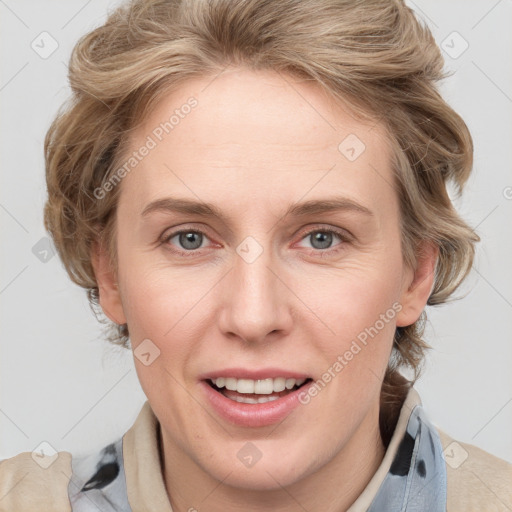 Joyful white adult female with medium  brown hair and blue eyes