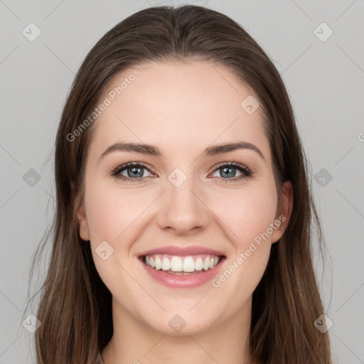 Joyful white young-adult female with long  brown hair and grey eyes