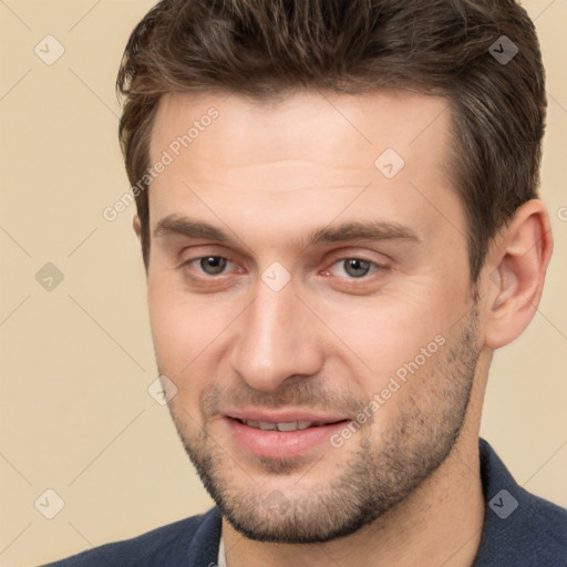 Joyful white young-adult male with short  brown hair and brown eyes