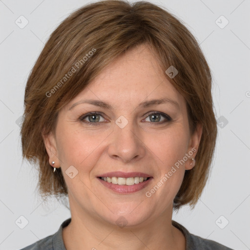 Joyful white adult female with medium  brown hair and grey eyes