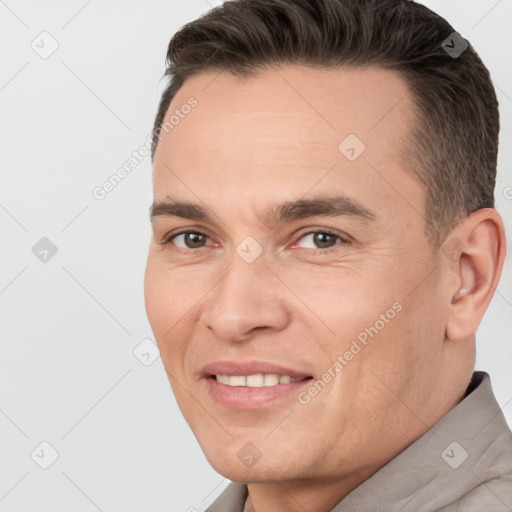 Joyful white young-adult male with short  brown hair and brown eyes