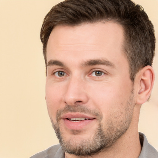 Joyful white young-adult male with short  brown hair and brown eyes