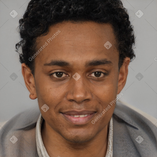 Joyful black young-adult male with short  brown hair and brown eyes