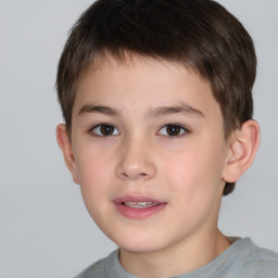 Joyful white child male with short  brown hair and brown eyes