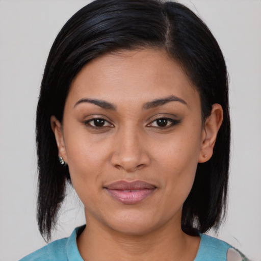 Joyful asian young-adult female with medium  brown hair and brown eyes