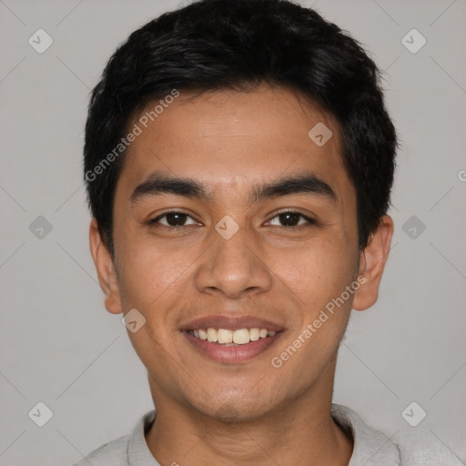 Joyful latino young-adult male with short  black hair and brown eyes