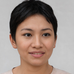 Joyful asian young-adult female with short  brown hair and brown eyes