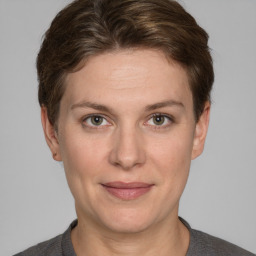 Joyful white adult female with short  brown hair and grey eyes