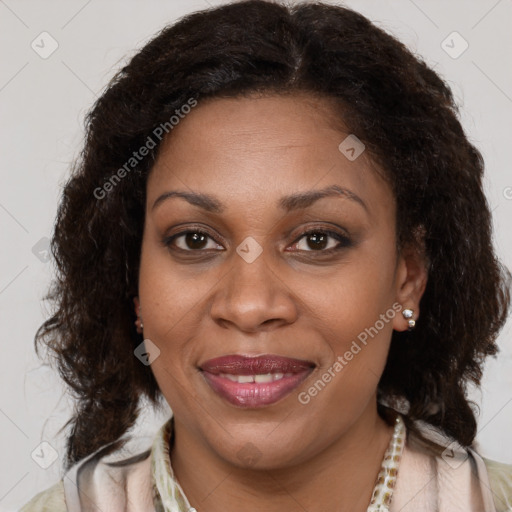 Joyful black young-adult female with medium  brown hair and brown eyes