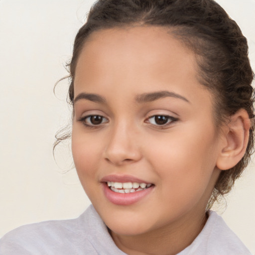 Joyful white child female with short  brown hair and brown eyes