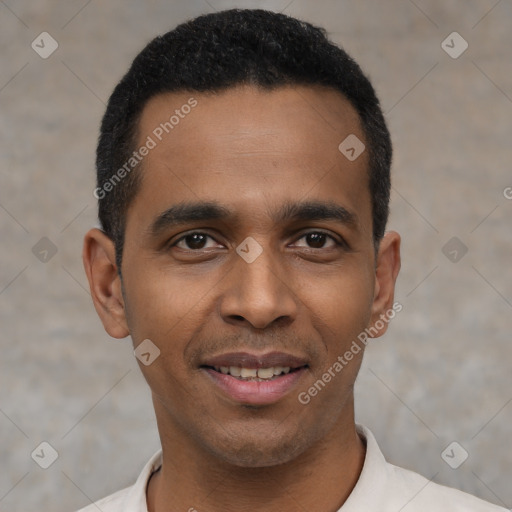 Joyful latino young-adult male with short  black hair and brown eyes