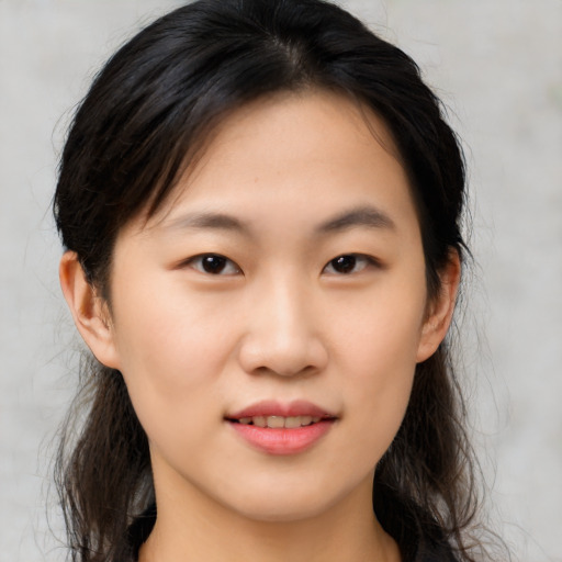 Joyful asian young-adult female with medium  brown hair and brown eyes