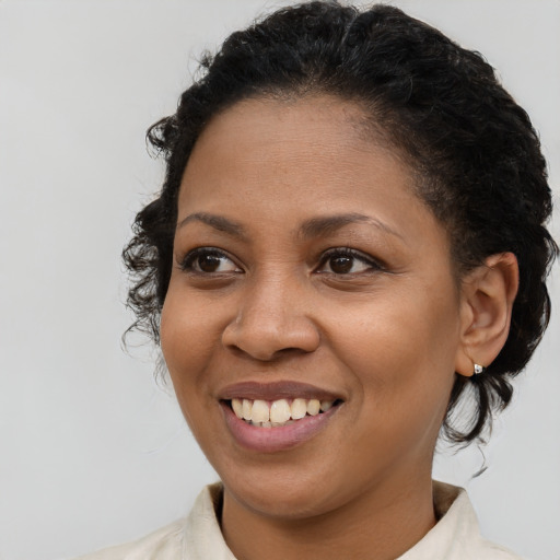 Joyful latino young-adult female with short  brown hair and brown eyes