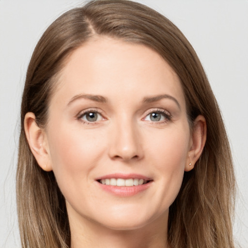 Joyful white young-adult female with long  brown hair and grey eyes