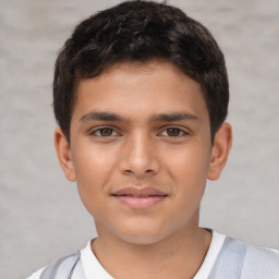 Joyful white child male with short  brown hair and brown eyes