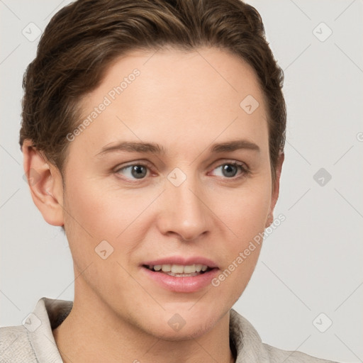 Joyful white young-adult female with short  brown hair and grey eyes