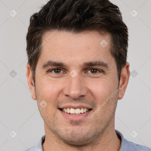 Joyful white young-adult male with short  brown hair and brown eyes