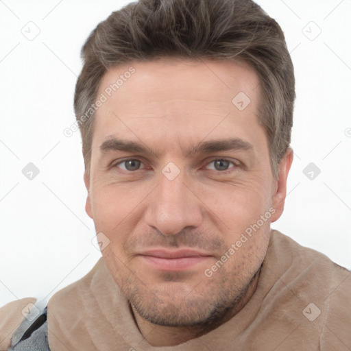 Joyful white adult male with short  brown hair and grey eyes