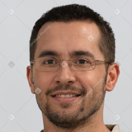 Joyful white adult male with short  brown hair and brown eyes