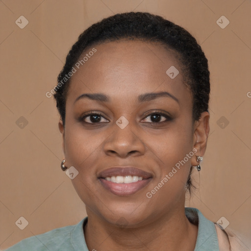 Joyful black young-adult female with short  black hair and brown eyes