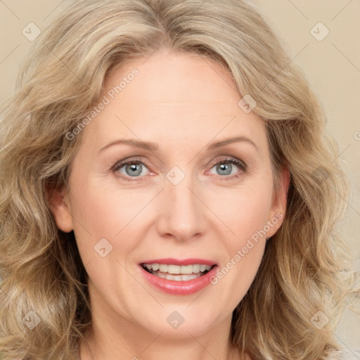 Joyful white adult female with medium  brown hair and green eyes