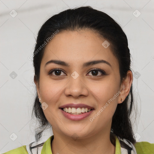 Joyful latino young-adult female with medium  brown hair and brown eyes