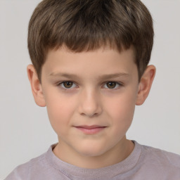 Joyful white child male with short  brown hair and brown eyes