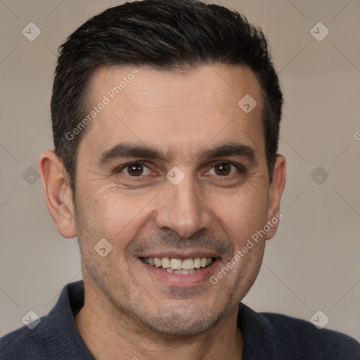 Joyful white adult male with short  brown hair and brown eyes