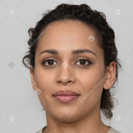 Joyful latino young-adult female with long  brown hair and brown eyes