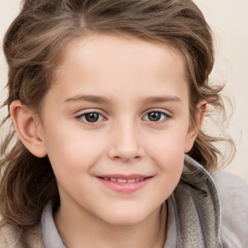 Joyful white child female with medium  brown hair and brown eyes