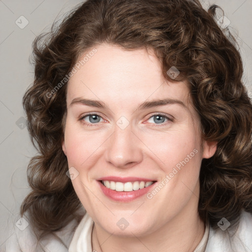 Joyful white young-adult female with medium  brown hair and green eyes