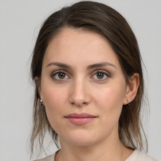 Joyful white young-adult female with medium  brown hair and grey eyes