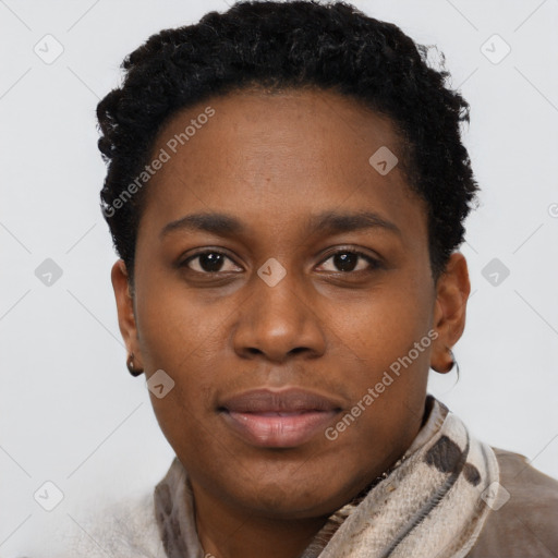 Joyful black young-adult female with short  brown hair and brown eyes