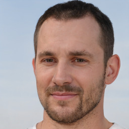 Joyful white adult male with short  brown hair and brown eyes