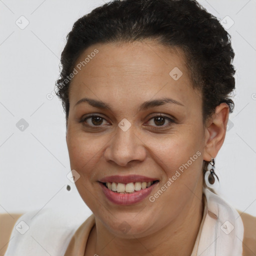 Joyful latino young-adult female with short  brown hair and brown eyes