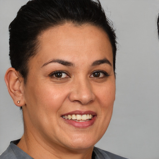 Joyful white adult female with short  brown hair and brown eyes