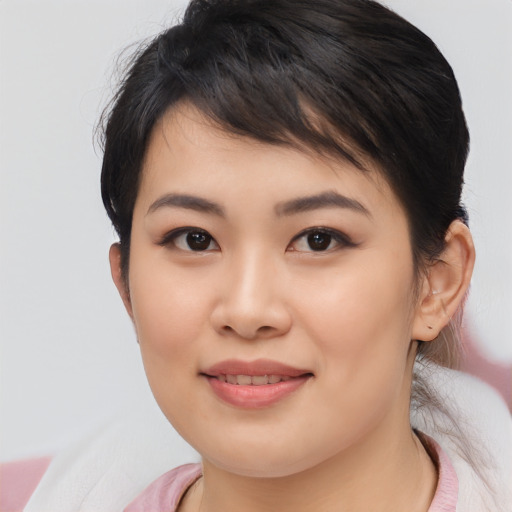 Joyful asian young-adult female with medium  brown hair and brown eyes