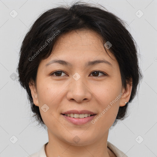 Joyful asian adult female with medium  brown hair and brown eyes