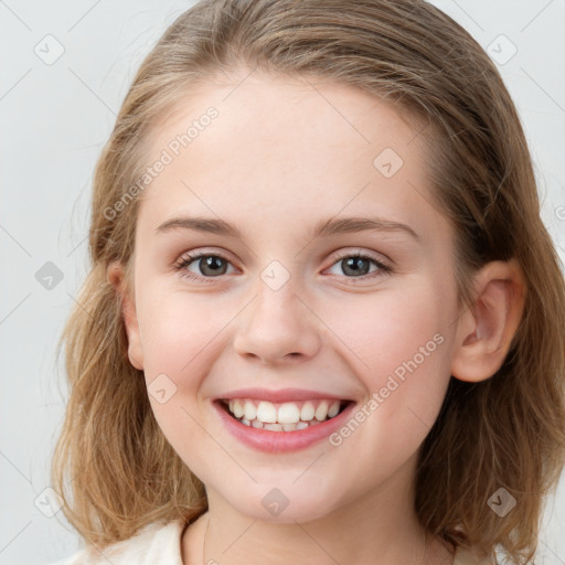 Joyful white child female with medium  brown hair and blue eyes