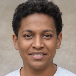 Joyful latino young-adult male with short  brown hair and brown eyes