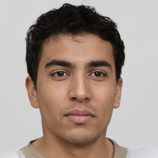 Neutral latino young-adult male with short  brown hair and brown eyes
