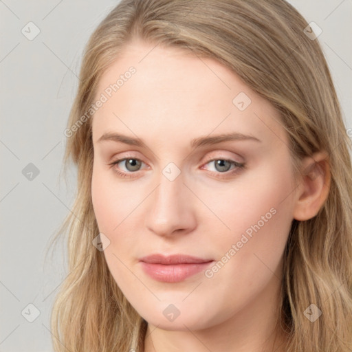 Joyful white young-adult female with long  brown hair and blue eyes