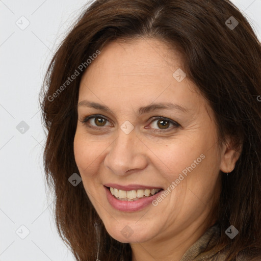 Joyful white adult female with long  brown hair and brown eyes