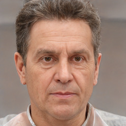 Joyful white middle-aged male with short  brown hair and brown eyes