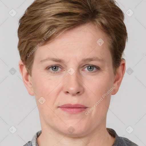 Joyful white adult female with short  brown hair and grey eyes