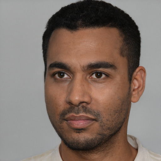 Neutral black young-adult male with short  black hair and brown eyes