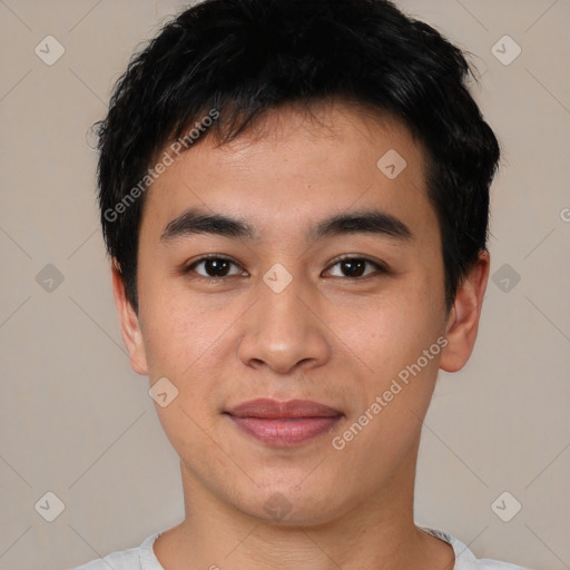 Joyful asian young-adult male with short  black hair and brown eyes