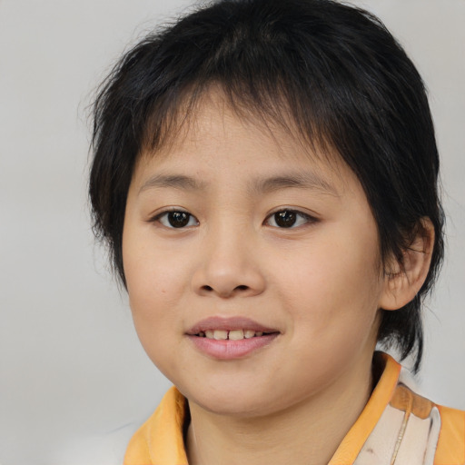 Joyful asian child female with medium  brown hair and brown eyes