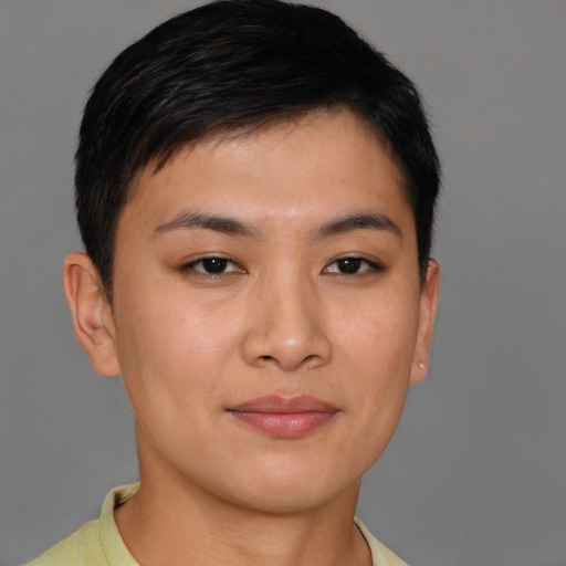 Joyful asian young-adult female with short  brown hair and brown eyes