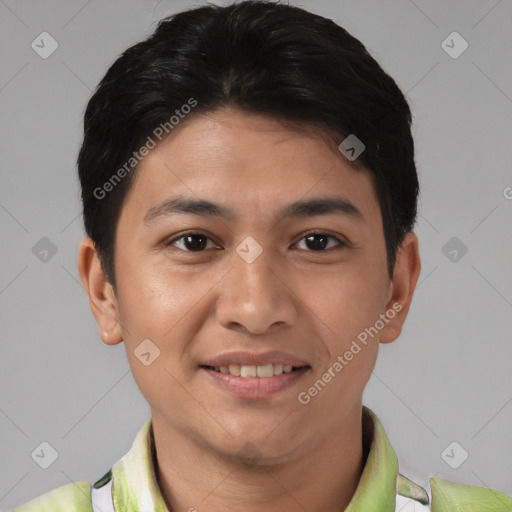 Joyful latino young-adult male with short  brown hair and brown eyes